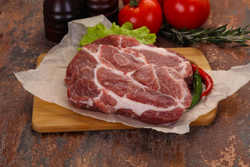 Raw pork neck steak