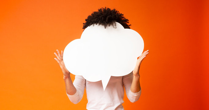 Black bushy man holding an empty speech bubble in front of his head