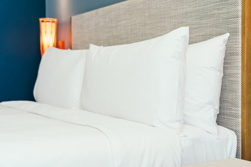 Fototapeta na wymiar Beautiful luxury comfortable pillow on bed with light lamp