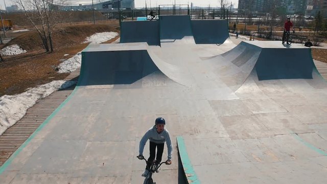 An alone bmx rider in the skatepark