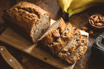 Banana Bread Loaf Sliced On Wooden Table. Wholegrain Banana Cake With Nuts © Vladislav Noseek