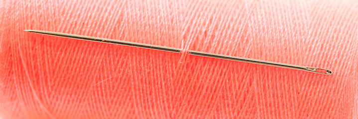 Red threat with needle