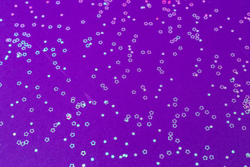 glitter stars on violet background. space