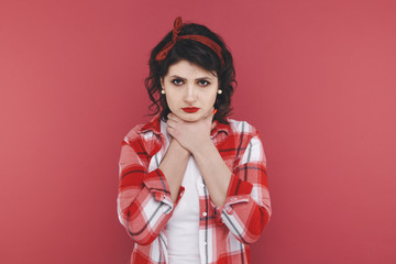 Woman feeling sick and holding hands on the neck