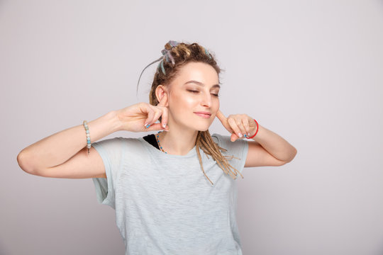 Young Woman Blocked Her Ears By Fingers Isolated