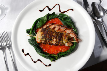 Shrimp brochettes grilled in tomato sauce, Shrimp are a typical dish of the sea.