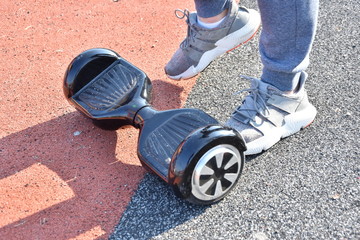 young man riding on the Hoverboard in the park