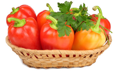 Sweet pepper in a basket isolated on a white background