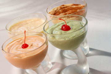 Lemon, papaya and coconut mousse with cherries.