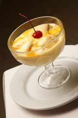 Lemon, papaya and coconut mousse with cherries.