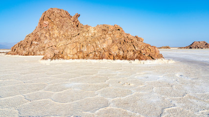Plain of salt with salty rocks in the Danakil Depression in Ethiopia, Africa.