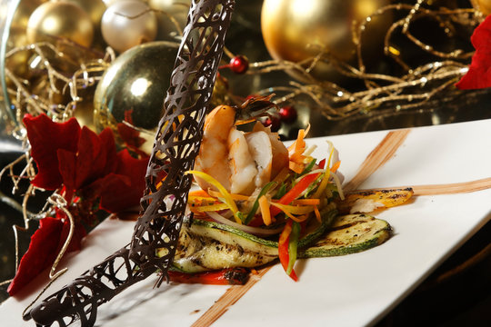 Beef Steak With Roasted Shrimp And Vegetable Garnish With Fried Plantain.