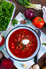 Borsch is a traditional Ukrainian dish in a bowl and products for its preparation. Top view, flat lay.