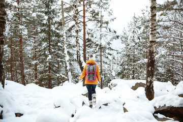 Beautiful woman in winter forest