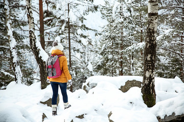Beautiful woman in winter forest