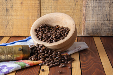 Coffee ready to be milled with old grinder