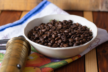 Coffee ready to be milled with old grinder
