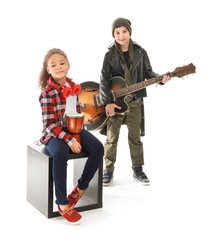 Band of little musicians on white background