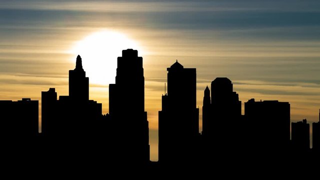 Kansas City skyline  in Time Lapse at Sunset with Skyscrapers in Silhouette, Missouri, United State