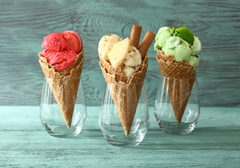 Assortment of tasty ice cream on wooden table