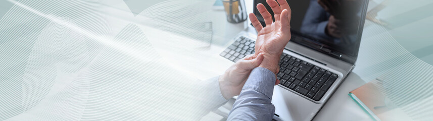 Businessman suffering from wrist pain. panoramic banner