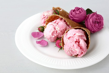 Plate with tasty ice cream on white table