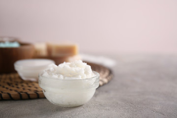 Bowl with body scrub on table