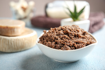 Bowl with body scrub on table
