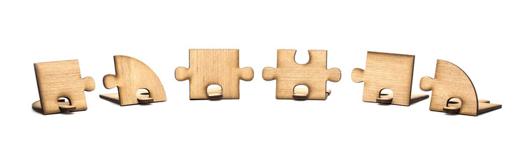  Three pieces of wooden jigsaw are connected together isolated on white background. concept of connecting