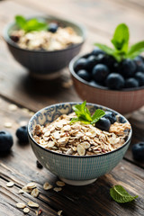 Mix of homemade cereal with blueberry and mint