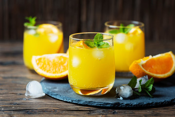 Fresh summer cocktail with orange and mint