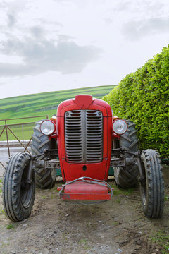 Vintage red tractor in a farm