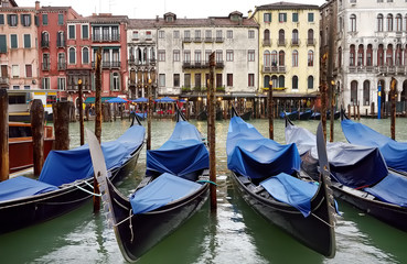 Fototapeta na wymiar Pier with gondolas in the Venice, Italy