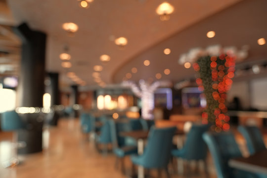 Abstract blur restaurant interior for background. Blur coffee shop or cafe restaurant with abstract bokeh light image background