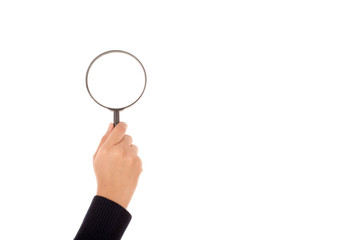 Hand holding magnifying glass isolated on white background