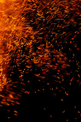 flame of fire with sparks on a black background