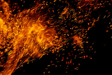 flame of fire with sparks on a black background