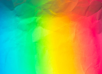 Multicolored paper background with yellow red blue and green