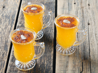 Healthy pumpkin fruit smoothie with seeds and mint leaves on table