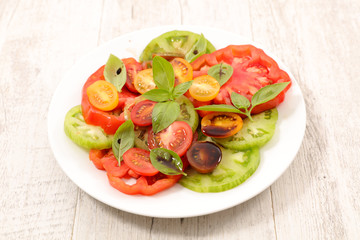 tomato salad with sauce and basil