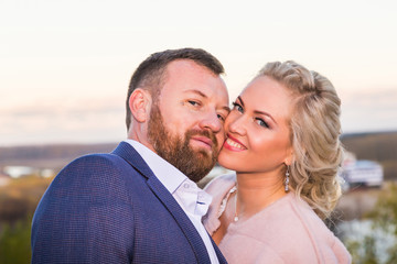 Fototapeta premium International bride and groom together in green city park