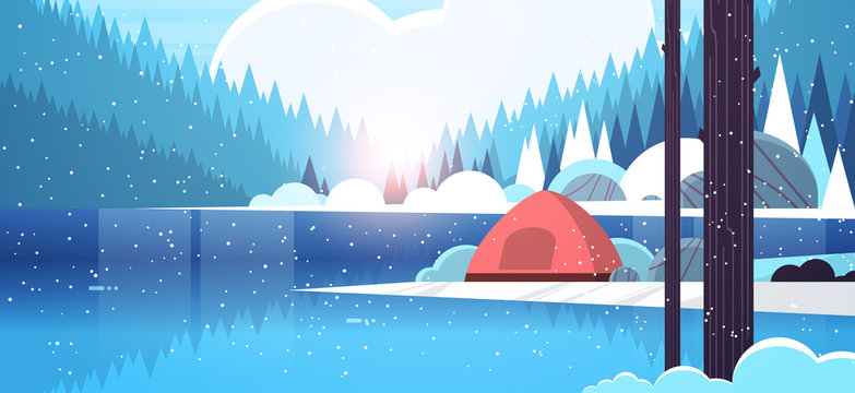 tent camping area in forest campsite near river winter camp travel vacation concept snowfall sunrise landscape nature background with water mountains and hills flat horizontal