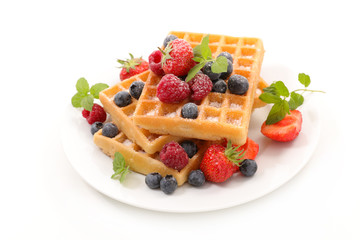 waffles with berries fruits on white background