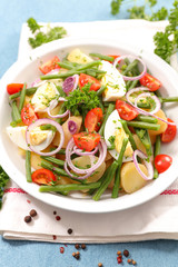 vegetable salad with egg, potato, bean and onion