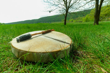 man playing a shaman tambourine