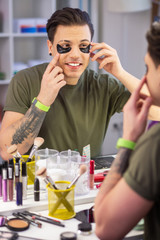 Contented man with wide smile enjoying his new experience