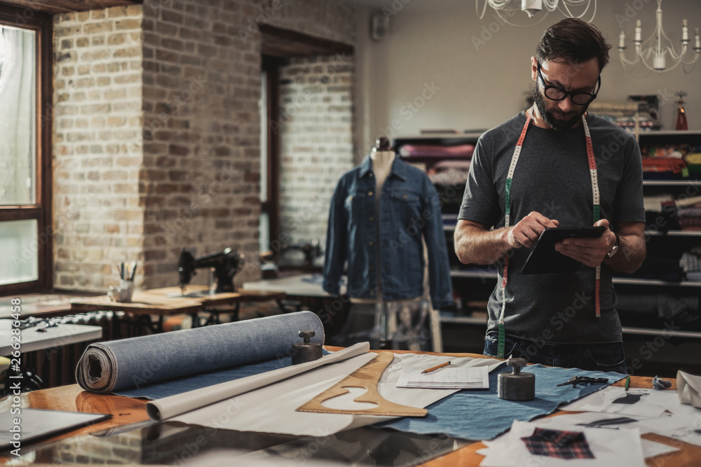 Sticker Fashion designer working in his studio