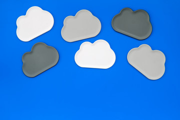 cloud computing concept with clouds on blue background top view space for text