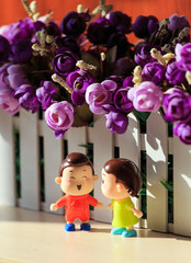 A boy doll and a girl doll