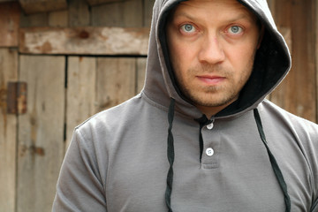 Portrait of the serious man in a hood.